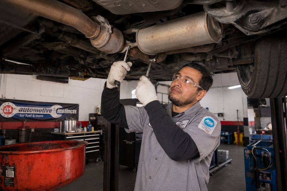 Auto Repair Services Mechanic Working on Engine
